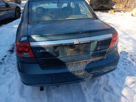 177.gm7l03 Saturn Sat L Sdn 2003 Fuel Filler Door 10061