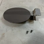 2004-2009 Mazda 3 Fuel Door Gas Lid Gray Oem. Fixed Price $35.00.
