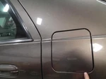 Deville 2002 Fuel Filler Door 1850829. Fixed Price $74.00.