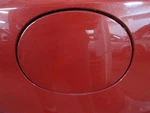 Fuel Filler Door Mazda 2005 Red 639782. Fixed Price $50.00.