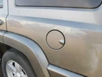 Commander 2007 Fuel Filler Door 365602. Fixed Price $55.00.