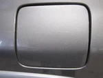 Fuel Filler Door Mazda Tribute 2002 Gray 527819. Fixed Price $49.00.