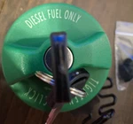 New Motorad Deisel Gas Cap With Key Green Colored MGC233KAD 17591D. Fixed Price $20.00.