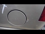 Tan Chevrolet Tahoe 1999 Fuel Filler Door 733043. Fixed Price $45.00.